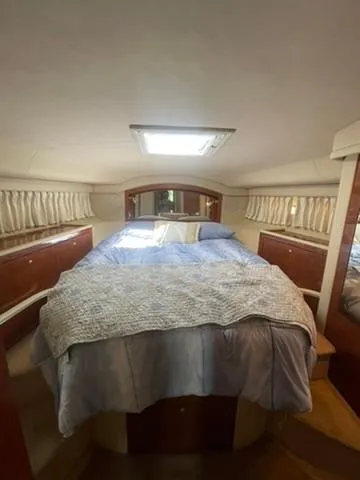 Yacht Photos Pics 2003 Sea Ray 400 Sedan Bridge cabin with bed, skylight, and wooden accents.