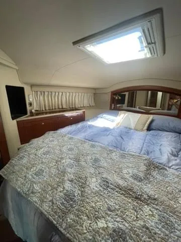  Yacht Photos Pics Luxurious bedroom interior of 2003 Sea Ray 400 Sedan Bridge yacht.