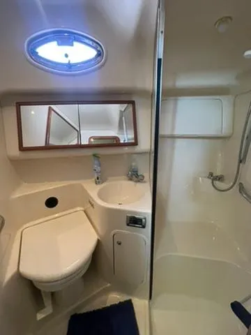  Yacht Photos Pics 2003 Sea Ray 400 Sedan Bridge bathroom with sink, toilet, and shower.