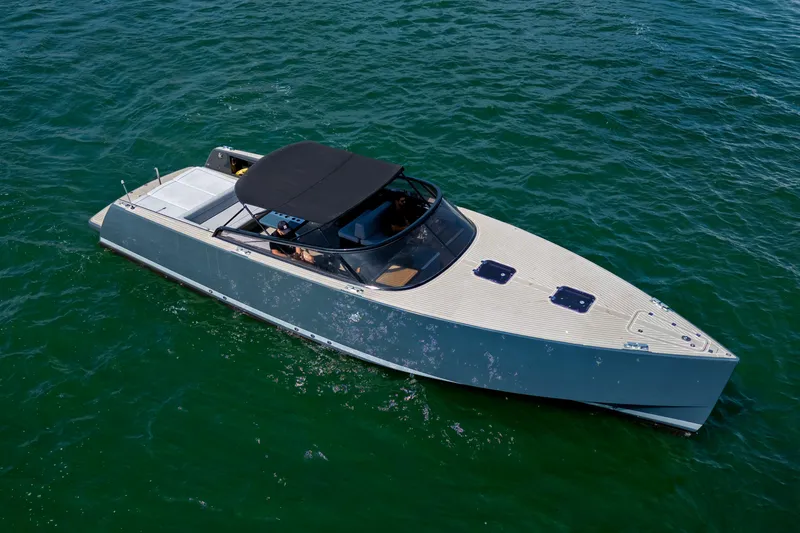 Drakaris Yacht Photos Pics 2014 VanDutch 40 yacht cruising on open water, sleek design, black canopy.