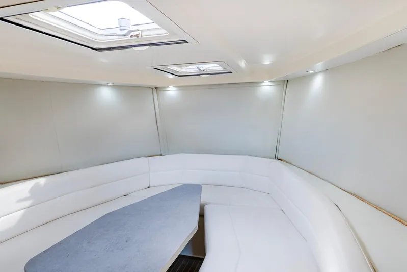 Drakaris Yacht Photos Pics Luxurious interior of 2014 VanDutch 40 yacht with white seating and skylights.