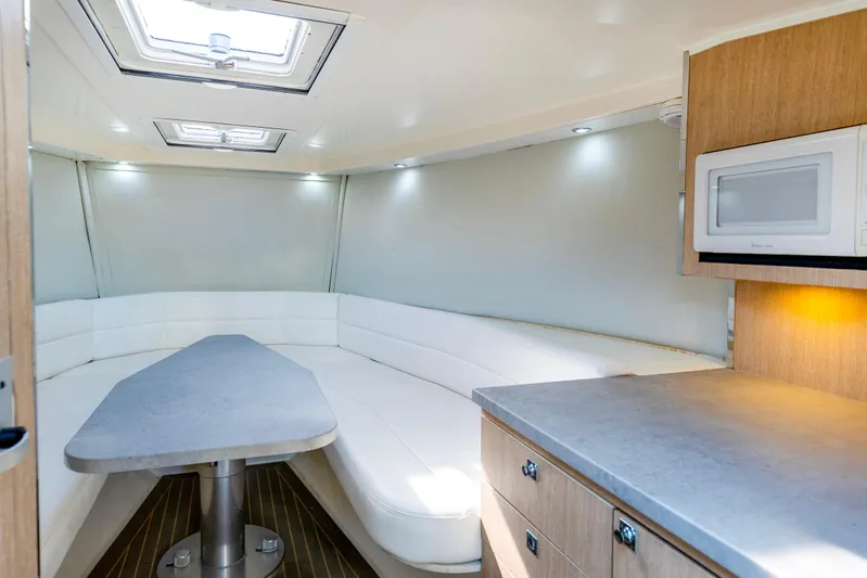 Drakaris Yacht Photos Pics Interior of 2014 VanDutch 40 yacht with modern seating and kitchenette.