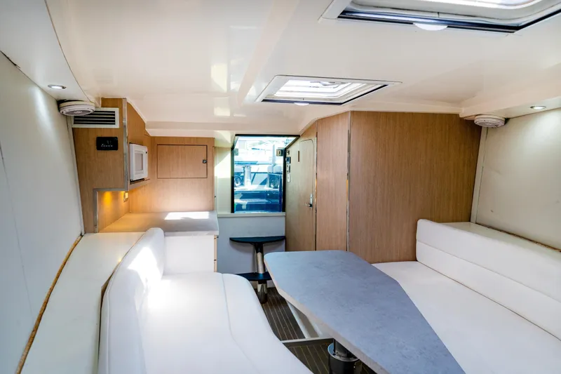 Drakaris Yacht Photos Pics Interior of 2014 VanDutch 40 yacht with modern seating and wooden cabinetry.