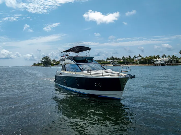 Good Deeds Yacht Photos Pics 2015 Beneteau Monte Carlo 5 yacht cruising on a sunny day near the coast.