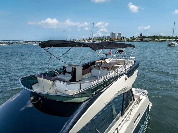 Good Deeds Yacht Photos Pics 2015 Beneteau Monte Carlo 5 yacht with spacious deck, cruising on a sunny day.