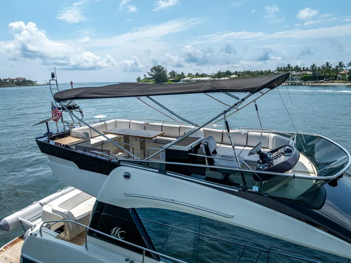 Good Deeds Yacht Photos Pics 2015 Beneteau Monte Carlo 5 yacht on serene water with clear skies.