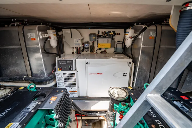 Good Deeds Yacht Photos Pics Engine room of 2015 Beneteau Monte Carlo 5 yacht with Cummins Onan generator.