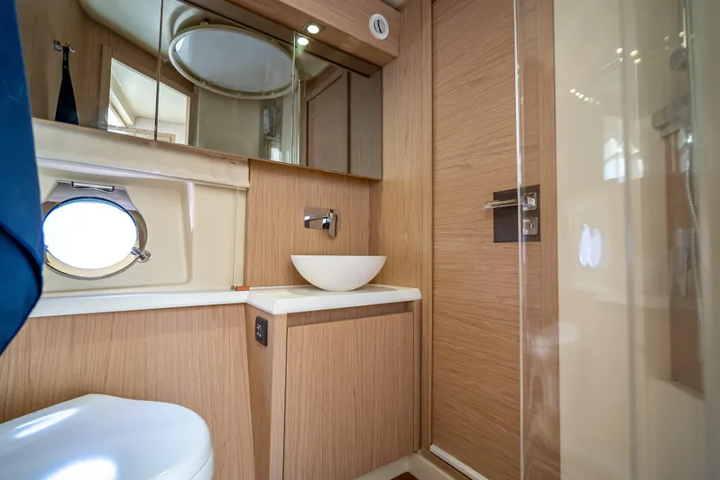 Good Deeds Yacht Photos Pics Luxurious bathroom interior of 2015 Beneteau Monte Carlo 5 yacht with modern fixtures.