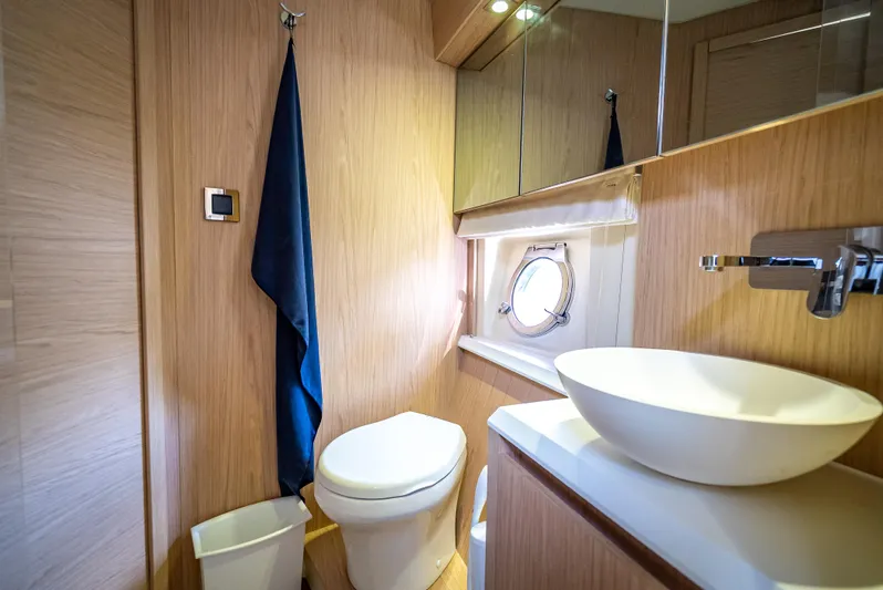 Good Deeds Yacht Photos Pics Luxurious bathroom in 2015 Beneteau Monte Carlo 5 yacht with modern fixtures and porthole.