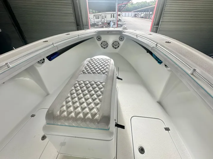  Yacht Photos Pics 2021 Yellowfin 36 Offshore boat interior with diamond-stitched seating and storage compartments.