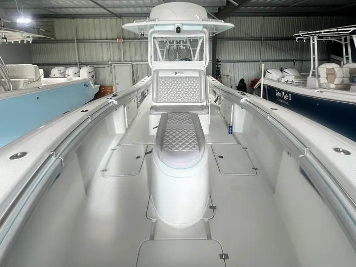  Yacht Photos Pics 2021 Yellowfin 36 Offshore boat interior with sleek design and spacious seating.