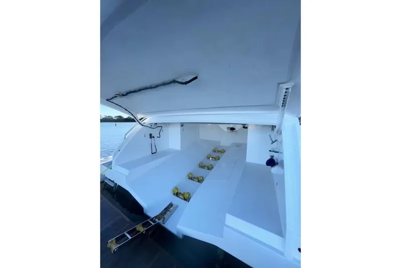  Yacht Photos Pics Azimut GRANDE 25 METRI 2022 yacht interior with open storage compartment.