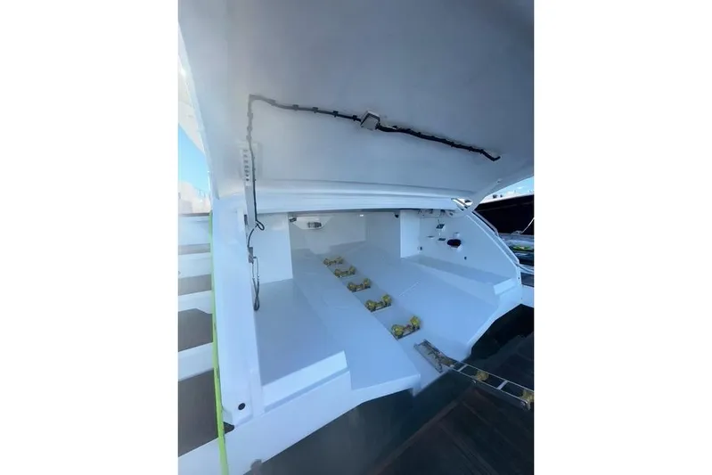  Yacht Photos Pics Open storage compartment of 2022 Azimut GRANDE 25 METRI yacht, showcasing interior details.