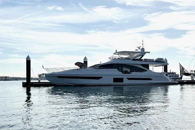  Yacht Photos Pics 2022 Azimut GRANDE 25 METRI yacht docked on calm water under a clear sky.