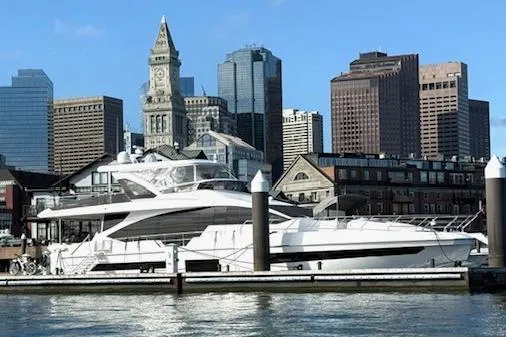  Yacht Photos Pics Azimut GRANDE 25 METRI 2022 yacht docked with city skyline backdrop.