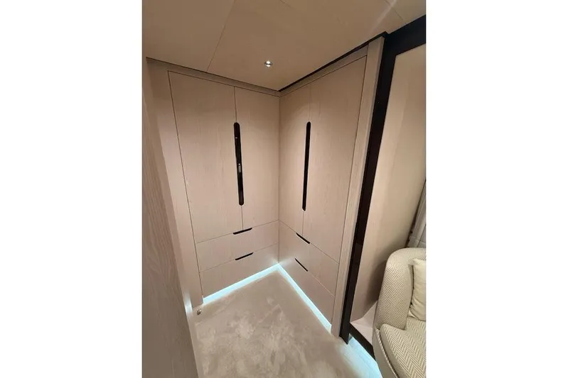  Yacht Photos Pics Luxurious interior of 2022 Azimut GRANDE 25 METRI yacht with modern wood cabinetry.
