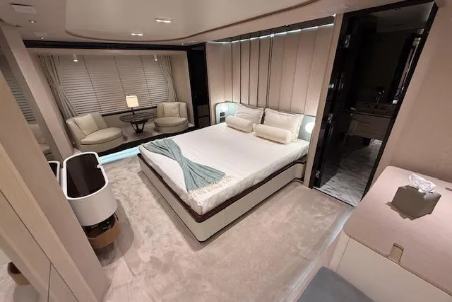  Yacht Photos Pics Luxurious bedroom interior of 2022 Azimut GRANDE 25 METRI yacht, featuring elegant furnishings.