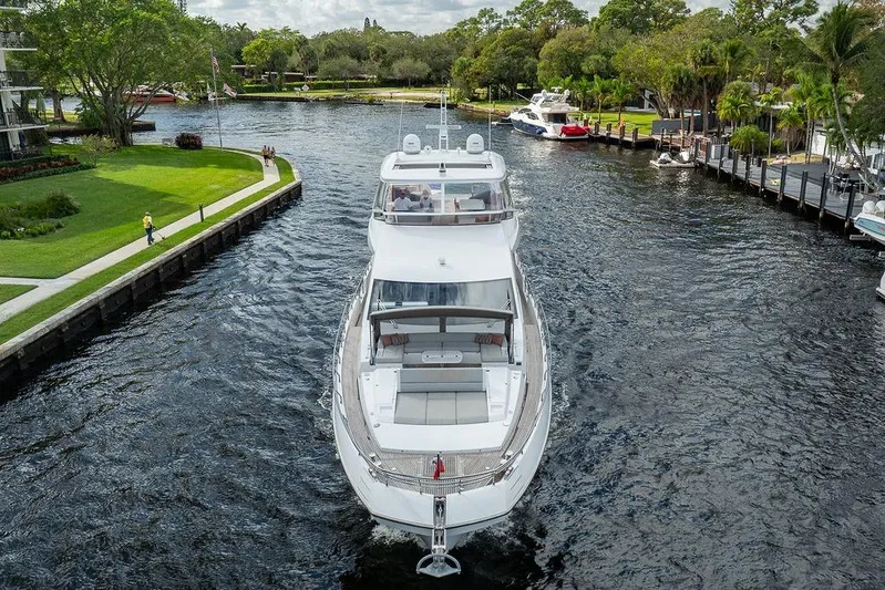  Yacht Photos Pics Luxury 2022 Azimut GRANDE 25 METRI yacht cruising through a scenic waterway.