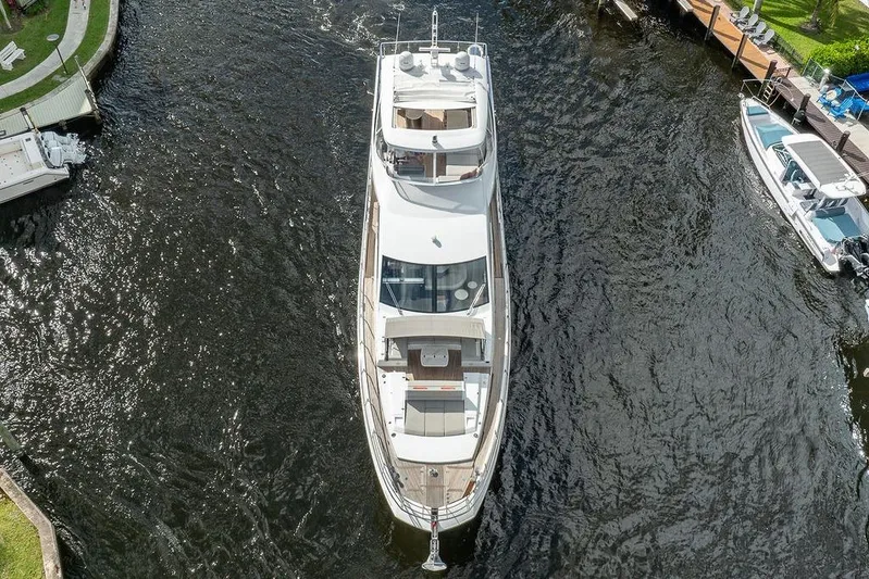  Yacht Photos Pics Aerial view of 2022 Azimut GRANDE 25 METRI yacht cruising in a narrow waterway.