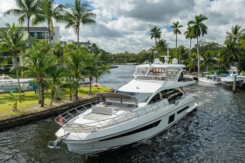  Yacht Photos Pics 2022 Azimut GRANDE 25 METRI yacht cruising near palm-lined shore.