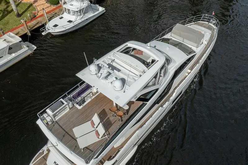  Yacht Photos Pics Aerial view of 2022 Azimut GRANDE 25 METRI yacht cruising on a river.