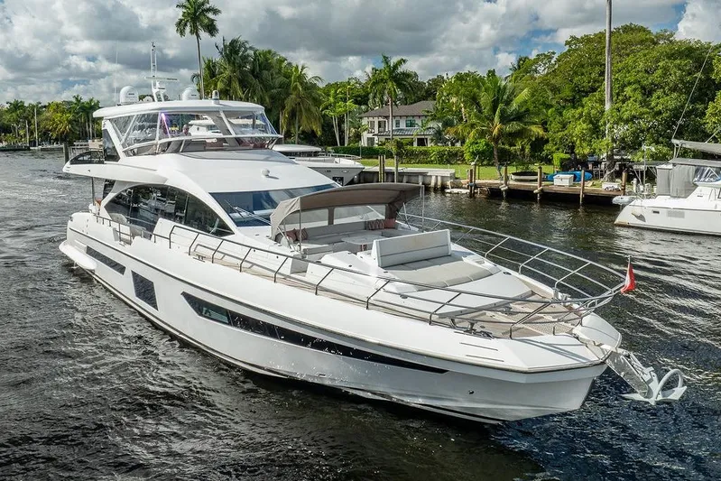 Yacht Photos Pics Luxury 2022 Azimut GRANDE 25 METRI yacht cruising on a scenic waterway.