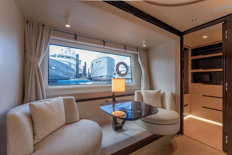  Yacht Photos Pics Luxurious interior of 2022 Azimut GRANDE 25 METRI yacht with elegant seating and window view.