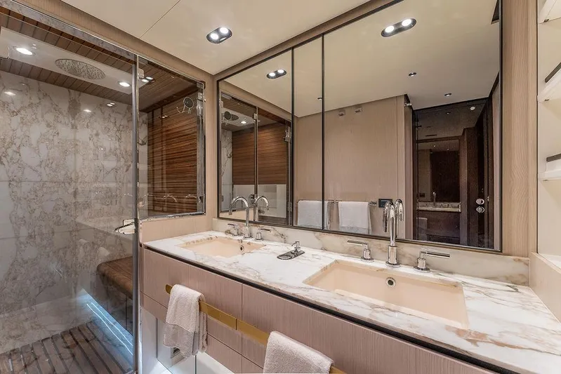  Yacht Photos Pics Luxurious bathroom in 2022 Azimut GRANDE 25 METRI yacht with marble countertops and modern fixtures.