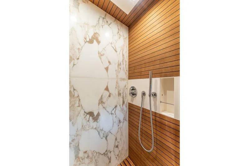  Yacht Photos Pics Luxurious shower with marble and wood accents in 2022 Azimut GRANDE 25 METRI yacht.