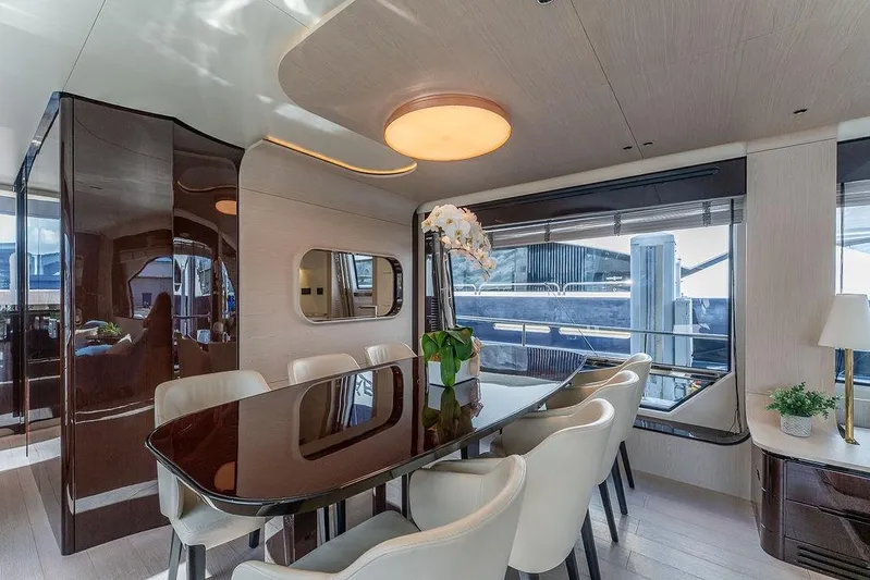  Yacht Photos Pics Luxurious dining area on 2022 Azimut GRANDE 25 METRI yacht, featuring elegant decor and large windows.