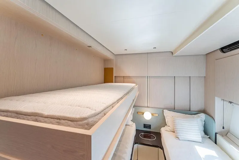  Yacht Photos Pics Luxurious cabin interior of 2022 Azimut GRANDE 25 METRI yacht with bunk beds.
