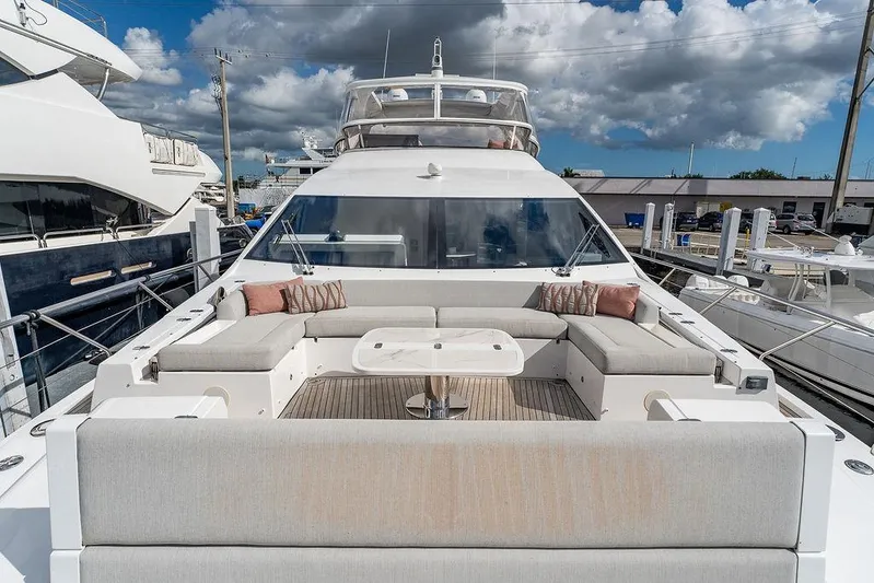  Yacht Photos Pics Luxurious 2022 Azimut GRANDE 25 METRI yacht with elegant outdoor seating area.