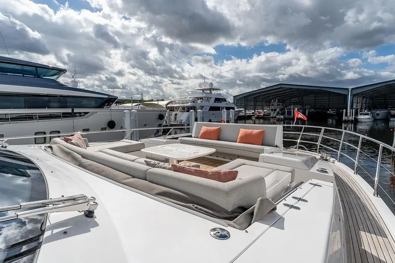  Yacht Photos Pics Luxurious 2022 Azimut GRANDE 25 METRI yacht with elegant outdoor seating and scenic marina view.