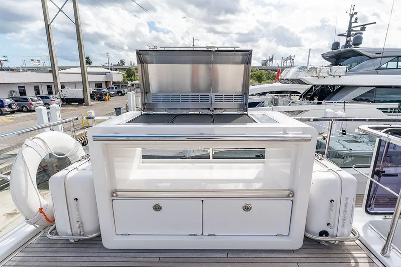  Yacht Photos Pics Outdoor kitchen on 2022 Azimut GRANDE 25 METRI yacht, featuring grill and storage.