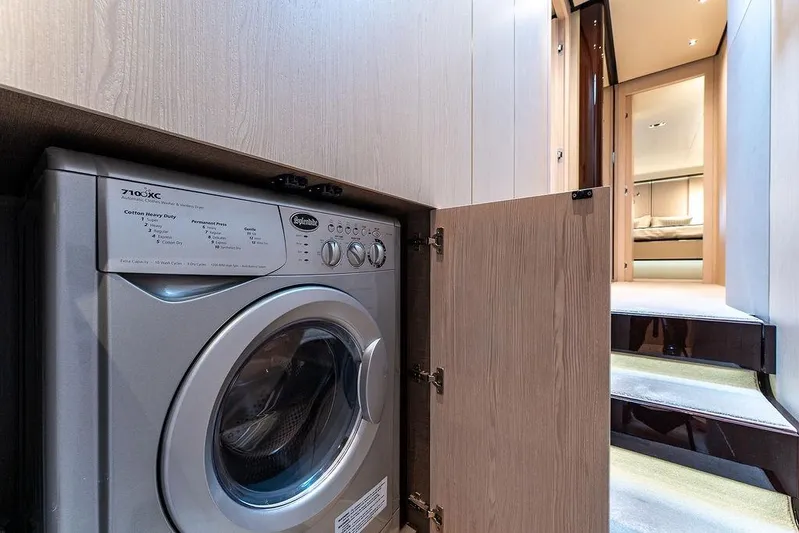 Yacht Photos Pics Laundry area inside 2022 Azimut GRANDE 25 METRI yacht, featuring a washing machine.