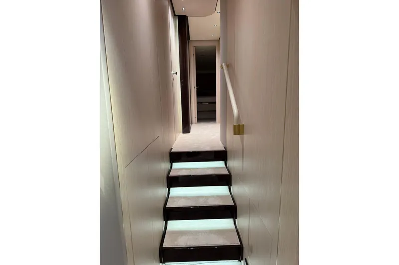  Yacht Photos Pics Interior staircase of 2025 Azimut Yachts 25 Metri Grande, featuring modern design and ambient lighting.