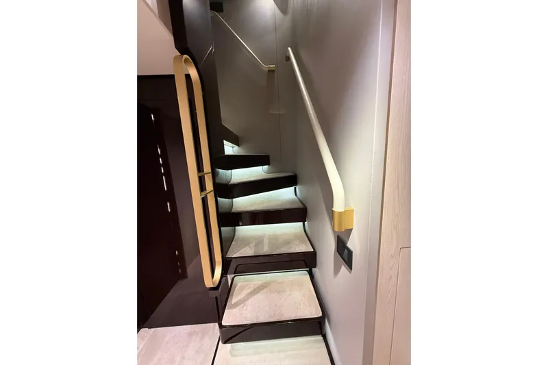 Yacht Photos Pics Luxurious staircase on 2025 Azimut Yachts 25 Metri Grande, featuring sleek design and ambient lighting.
