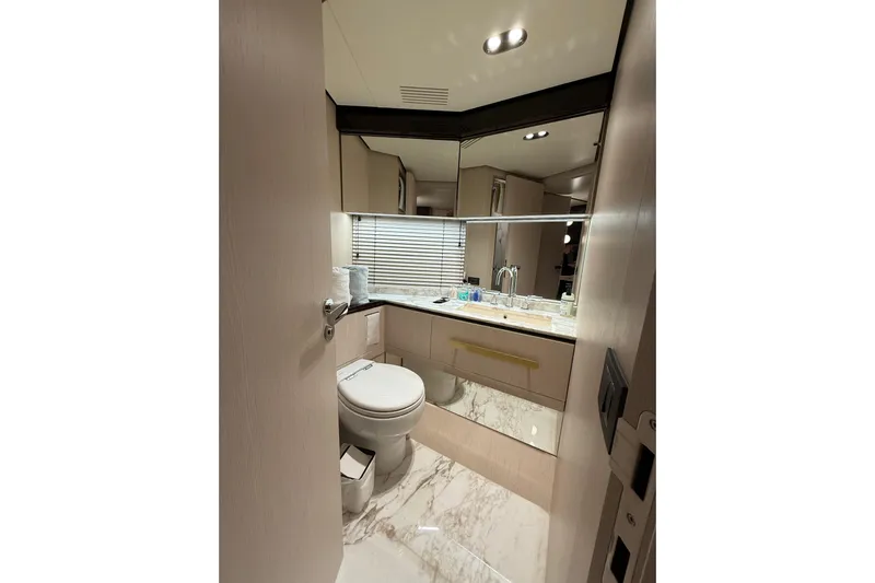  Yacht Photos Pics Luxurious bathroom in 2025 Azimut 25 Metri Grande yacht with marble flooring and modern fixtures.