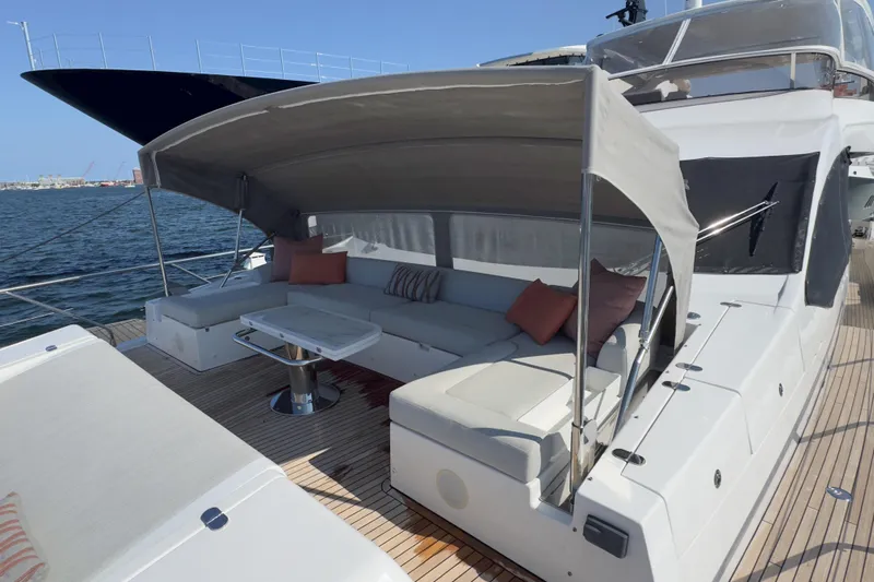  Yacht Photos Pics Luxurious 2025 Azimut 25 Metri Grande yacht with elegant outdoor seating area.