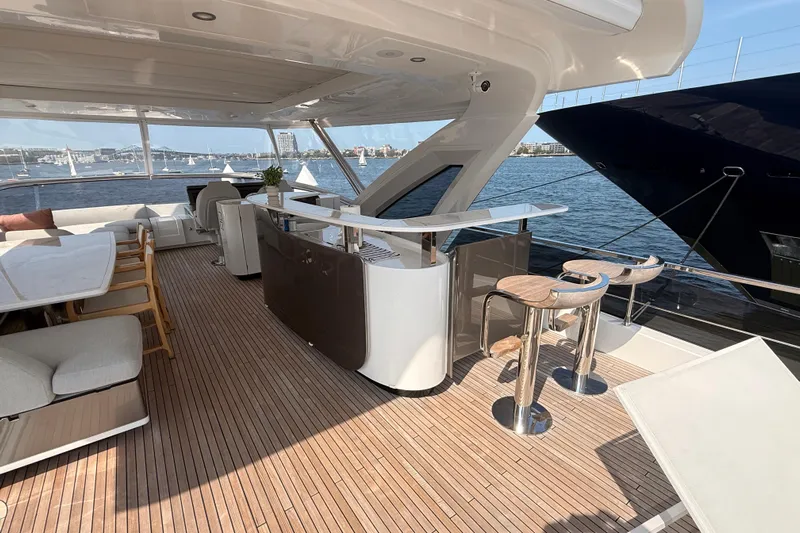  Yacht Photos Pics Luxurious 2025 Azimut 25 Metri Grande yacht deck with elegant seating and bar area.