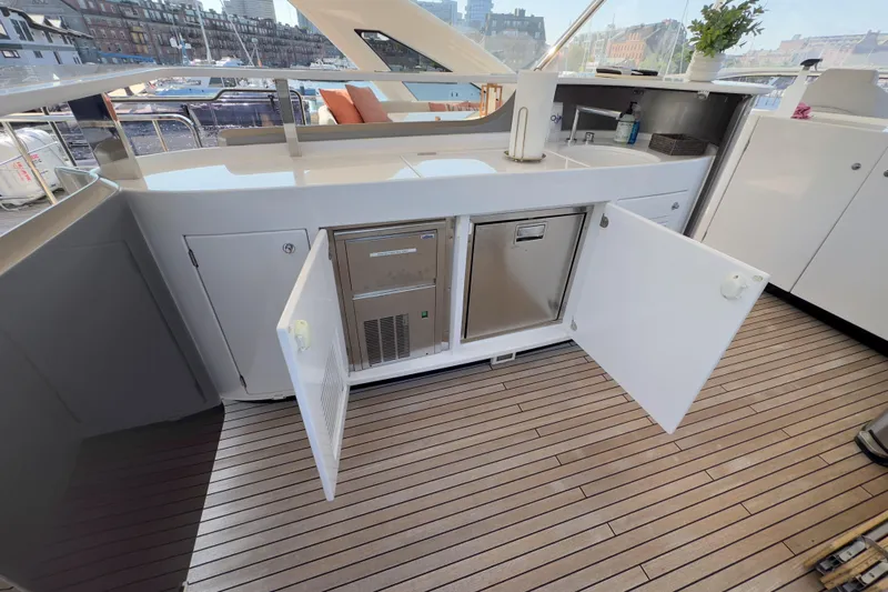  Yacht Photos Pics Luxurious 2025 Azimut 25 Metri Grande yacht deck with open storage and sleek design.