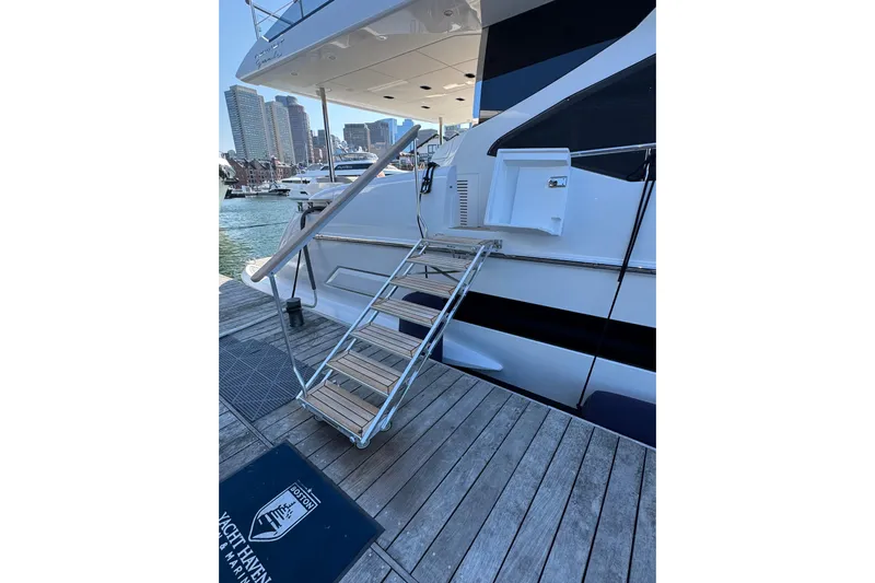  Yacht Photos Pics Luxury Azimut 25 Metri Grande yacht docked, featuring elegant boarding stairs, 2025 model.