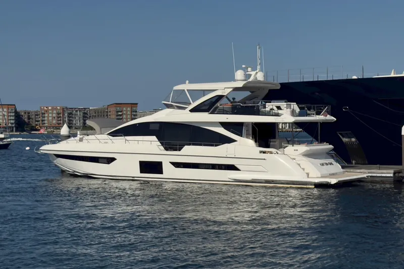  Yacht Photos Pics Luxurious 2025 Azimut Yachts 25 Metri Grande docked in a serene marina setting.