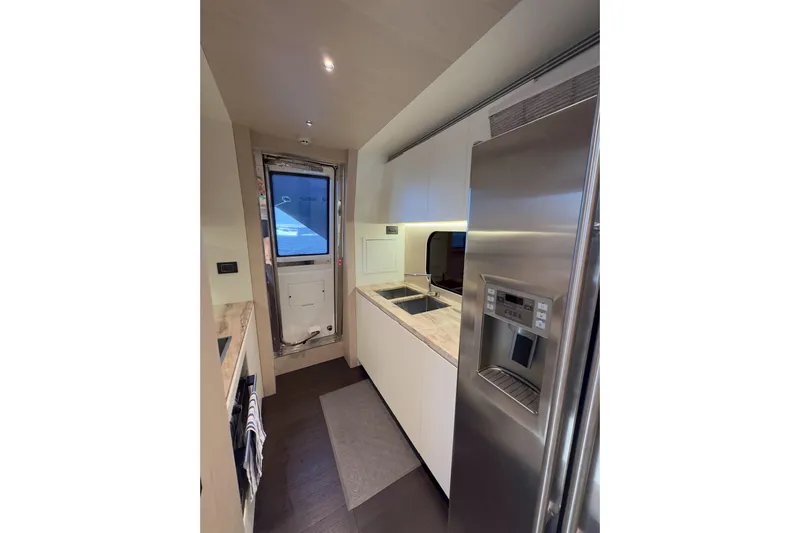  Yacht Photos Pics Modern kitchen interior of 2025 Azimut Yachts 25 Metri Grande, featuring sleek appliances.