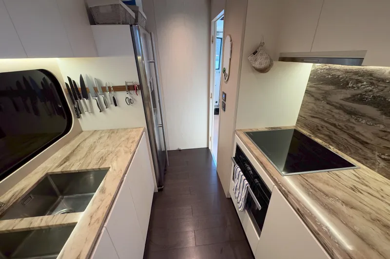  Yacht Photos Pics Luxurious kitchen in 2025 Azimut 25 Metri Grande yacht with modern appliances and sleek design.