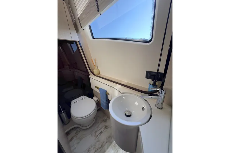  Yacht Photos Pics Luxurious bathroom in 2025 Azimut 25 Metri Grande yacht, featuring modern fixtures and elegant design.