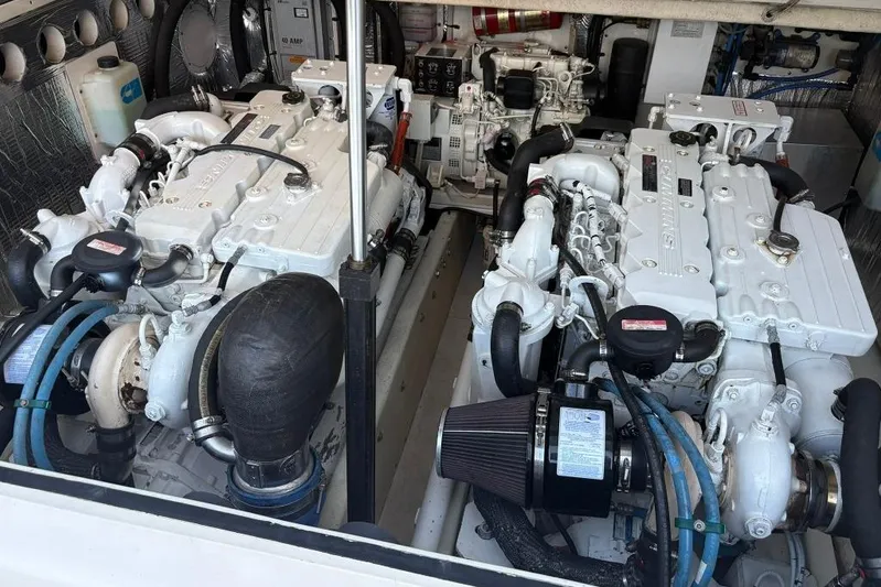  Yacht Photos Pics Engine room of a 2006 Carolina Classic 32 boat, featuring twin diesel engines.