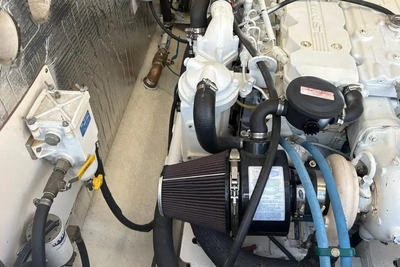  Yacht Photos Pics Engine compartment of a 2006 Carolina Classic 32 boat, showcasing detailed mechanical components.