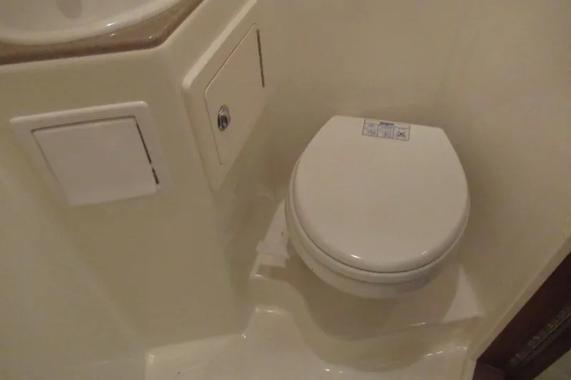  Yacht Photos Pics Compact marine toilet in 2006 Carolina Classic 32 boat bathroom.