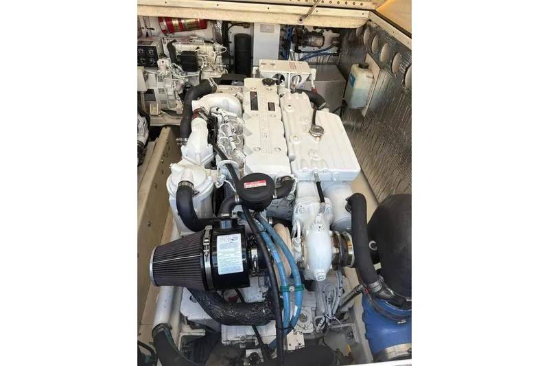  Yacht Photos Pics Engine compartment of a 2006 Carolina Classic 32 boat, showcasing detailed machinery.